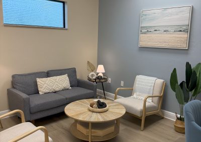 Therapy session room at the Fort Myers Location, Blue Loveseat couch with two arm chairs