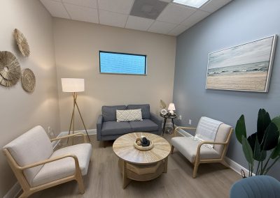 Therapy Session Room in Fort Myers, Loveseat couch and two arm chairs around a coffee table